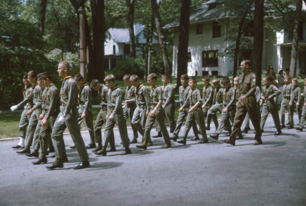 The khaki green uniform shirts, trousers, and shorts became a part of the Scouts official uniform in the 1940s until they were replaced by tan shirts in 1981. Baseball-style caps and red berets were added as optional headwear during this time as well.